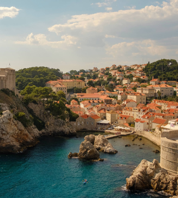 beautiful landscape with the sea in front and old houses in the background