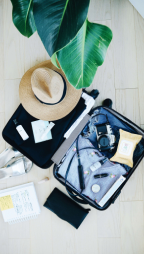 open suitcase with clothing, and other items